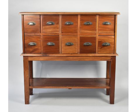 A Modern Chest of Ten Small Drawers with Stretcher Shelf Under, 91cms Wide, Matches Lot 28 and 29 