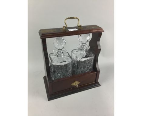 MAHOGANY REPRODUCTION TWO BOTTLE TANTALUS, along with an oak cased barometer and thermometer (2)