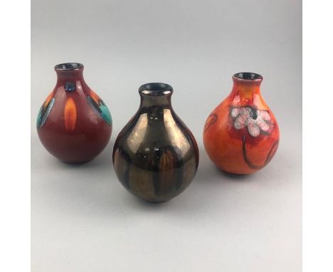 SIX POOLE POTTERY SMALL GOURD SHAPED VASES, the tallest vase 14cm high (6)