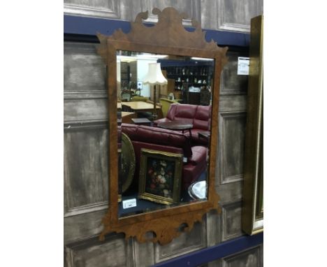 WALL MIRROR, in a walnut frame, 71cm high