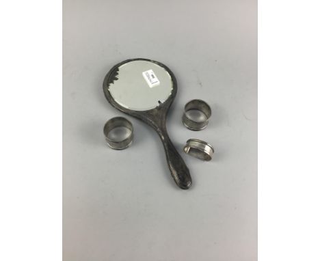 SILVER VANITY MIRROR, along with three silver napkin rings (4)