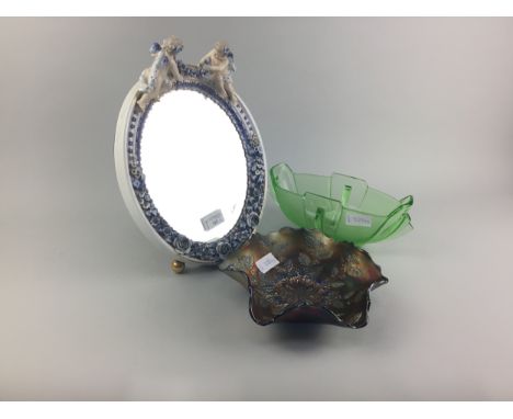 20TH CENTURY CERAMIC MIRROR, decorated with cherubs, along with a carnival glass bowl and an Art Deco style glass vase (3)