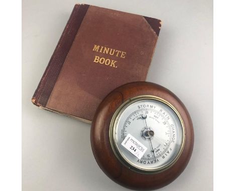 MAHOGANY CASED CIRCULAR WALL BAROMETER, 20cm diameter, along with a minute book containing vintage newspaper clippings (2)