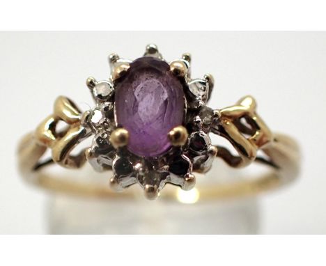 9ct gold diamond and amethyst daisy ring, size S/T, 2.0g. P&amp;P Group 1 (£14+VAT for the first lot and £1+VAT for subsequen