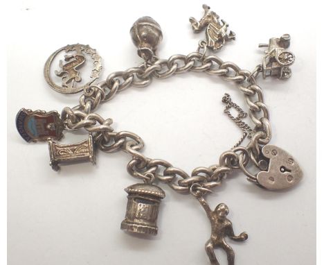 925 silver charm bracelet with eight charms to include tractor and dragon, L: 14 cm, combined 23g. P&amp;P Group 1 (£14+VAT f