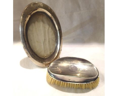 Hallmarked silver oval photograph frame and brush, frame L: 18 cm. P&amp;P Group 1 (£14+VAT for the first lot and £1+VAT for 