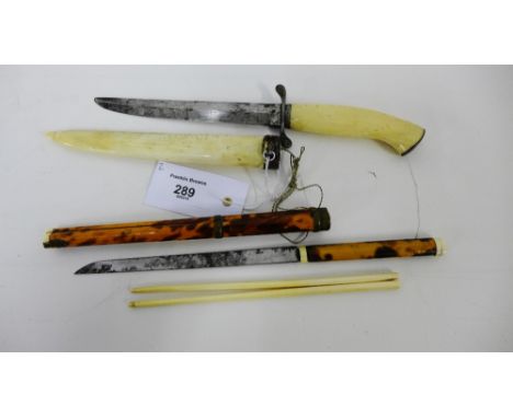 Ivory chopsticks and knife contained within a tortoiseshell mounted case together with a an ivory handled short dagger and sc