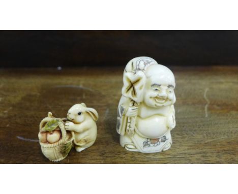 A Japanese netsuke in the form of a hare with a basket of fruit and acorns, signed to the base, together with a carved bone n