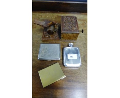 A mixed lot to include a ladies brass musical vanity compact, an Epns cigarette case, an EPBM hip flask and a carved wood nov