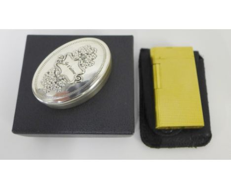 Sterling silver 'Je t'aime' pill box together with a gold plated Caran d'Ache vintage lighter (2) 