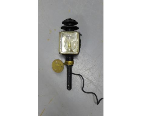 A black painted exterior lantern converted to electricity