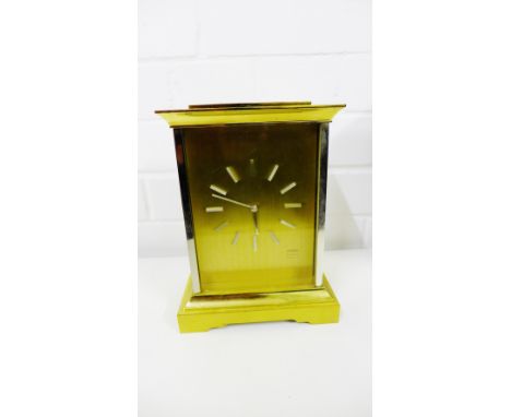 Angelus brass cased mantle clock with silvered hour batons, on plinth base, 21cm high 