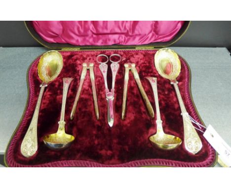 19th century Epns fruit and nut set comprising grape scissors, two pairs of nut cracks a sugar sifter, a small sauce ladle an