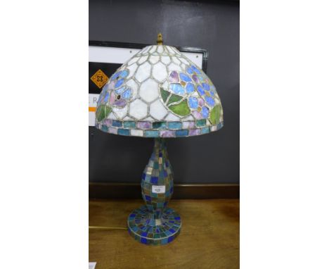 A stained glass and mosaic table lamp shade,  60cm high 