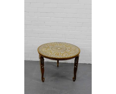 An Indian inlaid circular occasional table on shaped elephant trunk supports, 50 x 62cm 