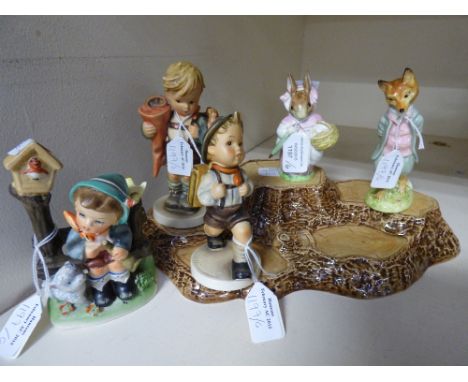 A pair of Beswick Beatrix Potter figures, a Beswick stand and three Hummel style figures 