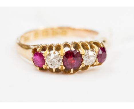 A Victorian ruby and diamond ring, claw set three graduated rubies, alternating with two old cut diamonds, Chester 1898, ring