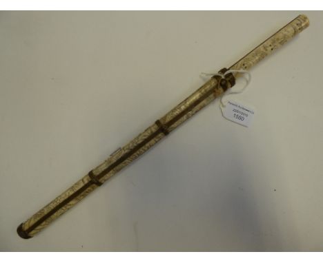 A late 19th century Oriental ivory inscribed knife and chopstick holder, complete with knife and chopsticks