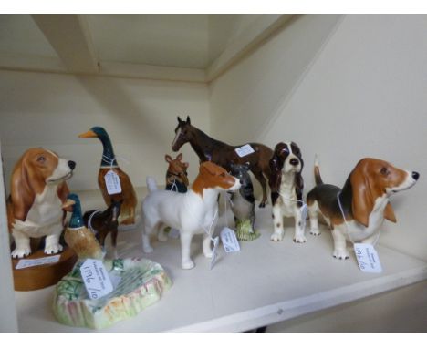 A collection of figures, comprising Beswick 'David' and 'John' bog figures, Beswick figural Duck ashtray, a large Beswick Duc