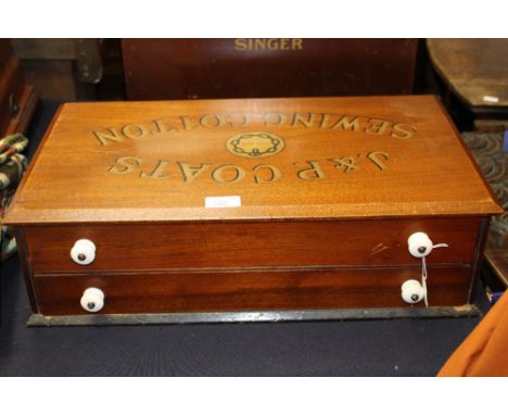 A J&P Coats sewing cotton mahogany box, probably late Victorian, fitted with two drawers with ceramic handles, bearing J&P Co