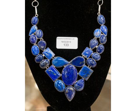 A lapis lazuli and silver necklace, ring and earrings, total weight 184 grams approx 