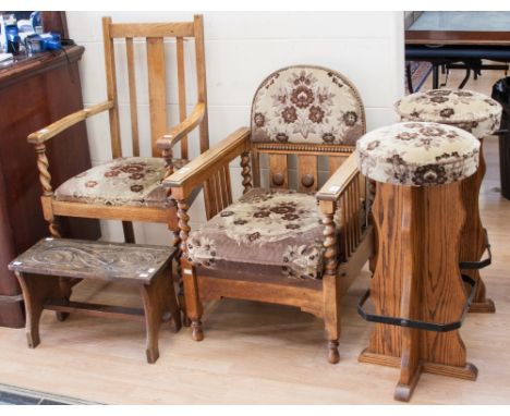 A collection of furniture, comprising a 1920's oak armchair, a reclining armchair, a pair of stools and a small oak stool, (5