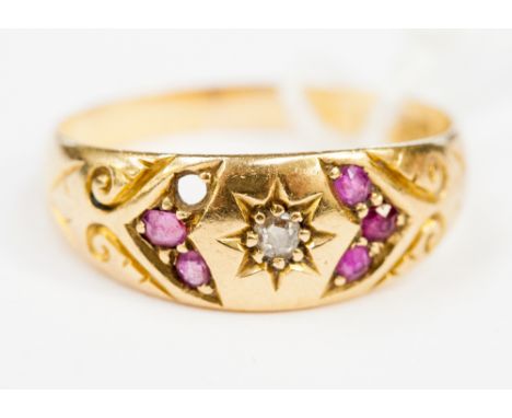 An 18ct gold ring set with diamonds and rubies, ring size N