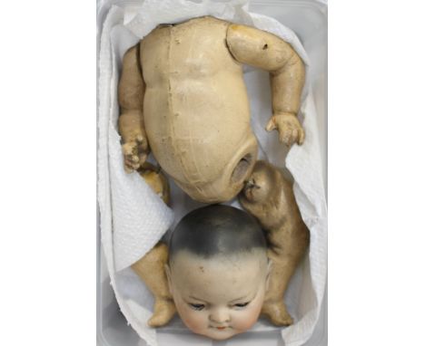 A German bisque head doll, blue moving eyes 