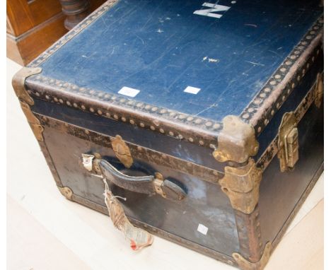 A 1940s steamer trunk, canvas covered with leather edges, with Cunard Line labels 