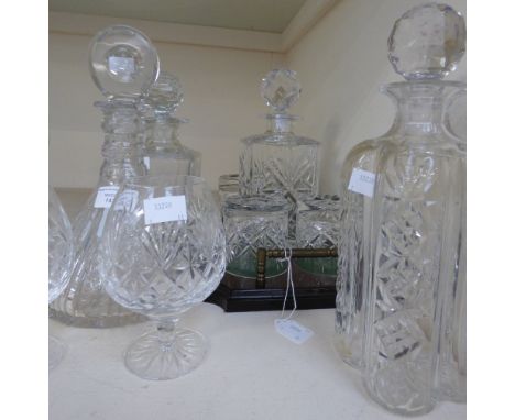 A cut glass decanter whisky set, comprising of square decanter and four tumblers complete with a mahogany stand, together wit