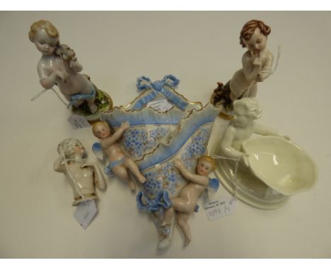 A Royal Worcester figural dish; a wall figural pocket; a pair of child figures etc
