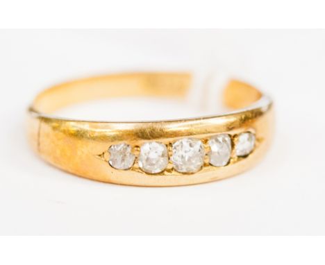 An 18ct gold five stone diamond ring, size N