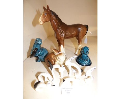 A collection of figures, comprising horse, three Poole pottery figures, one of a seal, one of a mouse, the other of a rabbit,
