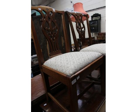 A George III set of six mahogany side chairs, circa 1770, in the manner of Thomas Chippendale, each with a serpentine shaped 