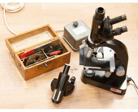 An Ernst Leitz Wetzlar binocular microscope with power supply 