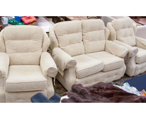 A GPlan traditional five piece suite, comprising two seater settee, three armchairs and a pouffe, all upholstered in cream, (