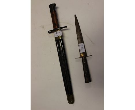 A ceremonial bayonet and scabbard and Indian inlaid dagger 