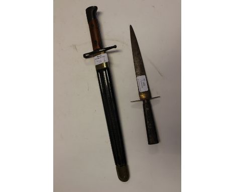 A ceremonial bayonet and scabbard and Indian inlaid dagger 