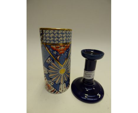 An 1880s masons ironstone 'Applique' (Japanesque) cylindrical vase and an earthenware navy blue candlestick (2) 