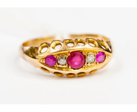 An 18ct gold ruby and diamond ring, size N1/2