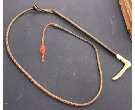 A ladies leather bound hunting whip with thong and lash 