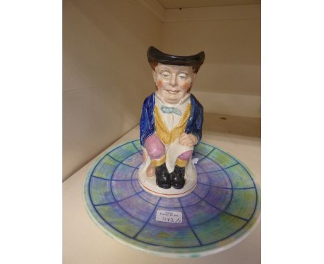 A Charlotte Rhead Crown Ducal Charger, with a Staffordshire pottery 'Chancellor' Toby jug (2) 