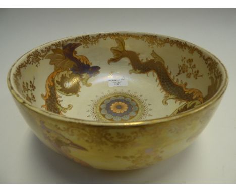 A 1930s Crown Devon Lustrine Fieldings bowl, decorated with Dragons on a yellow ground, the interior with Dragon decoration o