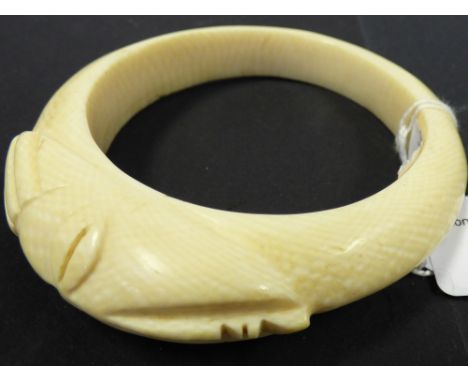 A 1930s Ivory bangle, tribal interest 