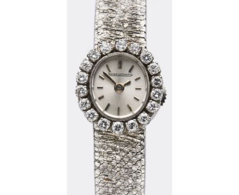 Kl. Damenarmbanduhr Jaeger-LeCoultre,Schweiz 2. Hälfte 20. Jh. 18 kt WG. Handaufzug. Gehäuse-Nr. 1047526. Lünette besetzt m. 