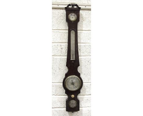 A mahogany wheel barometer, the narrow case with silvered dry/damp, thermometer and spirit level dials, signed J Killick, 21 