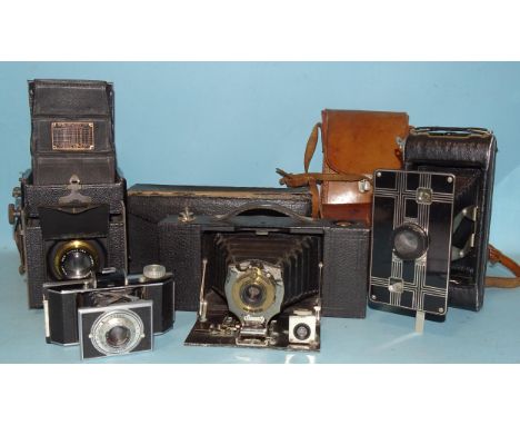 Four Kodak folding cameras: Auto Graflex Jnr Reflex camera, a Brownie Automatic, a Jiffy Six-16 and a Bantam, (shutters worki