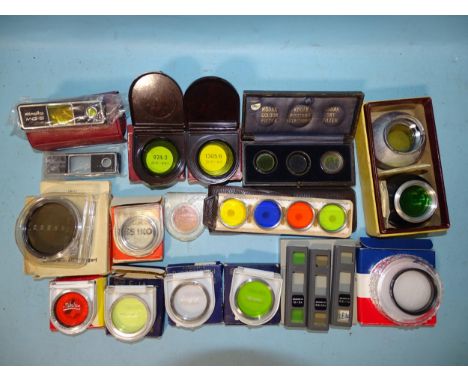 A quantity of filters by Carl Zeiss (9), Minolta (5), Minox (set of 3), and others. 