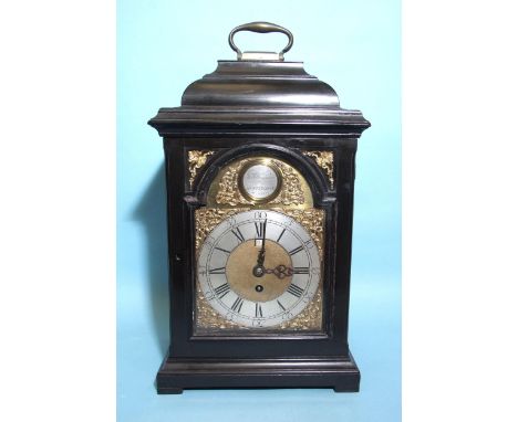 JOHN RAYMENT, HUNTINGDON. A MID-18TH CENTURY EBONISED INVERTED BELL-TOP BRACKET CLOCK, the case surmounted by a brass carryin