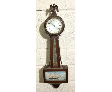 Seth Thomas, a 20th century stained wood wall clock with circular clockwork movement, silvered dial and marine-themed trunk a